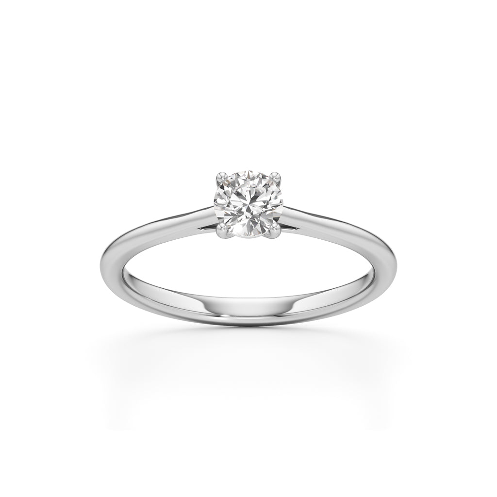 Solienara four prong round cut solitaire ring