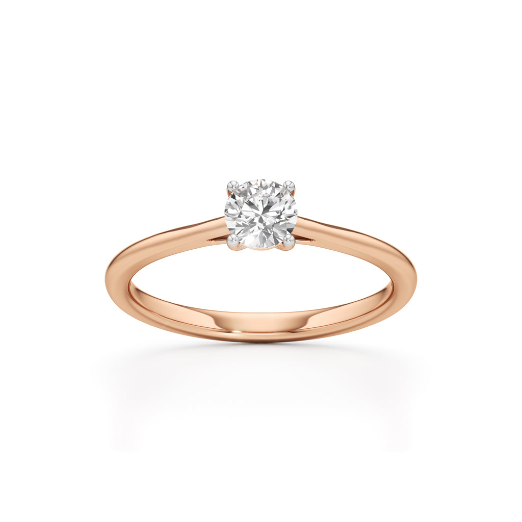 Solienara four prong round cut solitaire ring