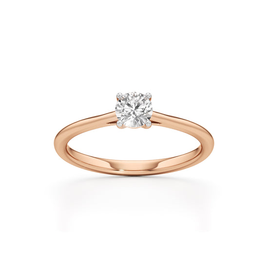 Solienara four prong round cut solitaire ring