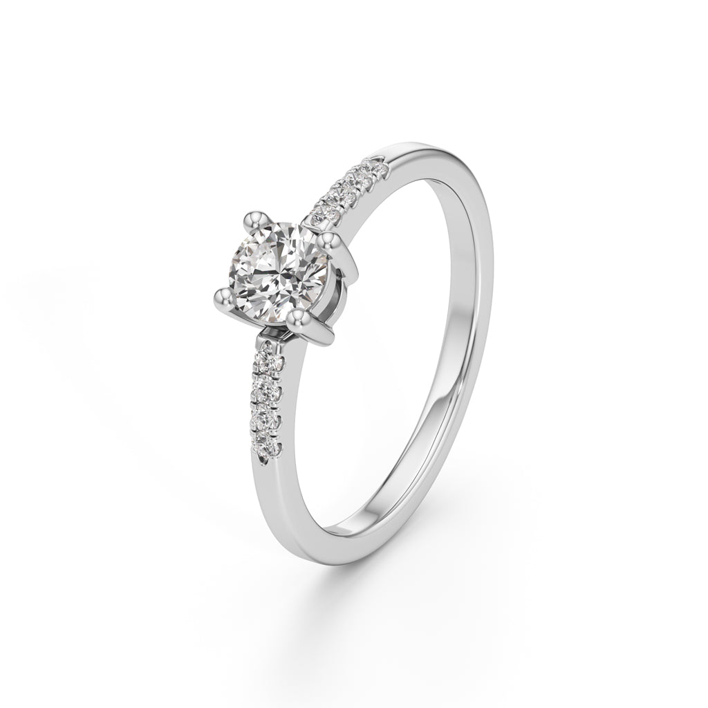 Vistara shared prong round cut side stone ring